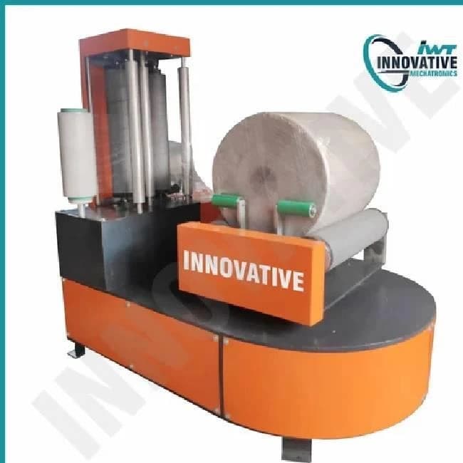 Automatic reel stretch wrapping machine
